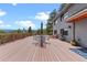 Large wooden deck with mountain views, outdoor seating, and a cozy lounge area, perfect for entertaining at 420 Chinook Rd, Idaho Springs, CO 80452