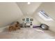 Living Room area featuring a sky light, rocking chair and exercise equipment at 420 Chinook Rd, Idaho Springs, CO 80452