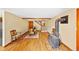 Cozy living room with wood-burning stove, hardwood floors, a staircase and a dining table set at 420 Chinook Rd, Idaho Springs, CO 80452