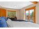 Inviting main bedroom with mountain views, natural light, and private access to outdoor deck at 420 Chinook Rd, Idaho Springs, CO 80452