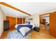 Spacious main bedroom featuring wood floors, exposed beams, and generous closet space at 420 Chinook Rd, Idaho Springs, CO 80452