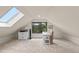 Comfortable home office space with skylight and views of the treelined backyard at 420 Chinook Rd, Idaho Springs, CO 80452