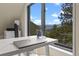 Comfortable home office space with desk and views of the mountain landscape at 420 Chinook Rd, Idaho Springs, CO 80452