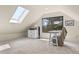 Comfortable home office space with skylight and views of the treelined backyard at 420 Chinook Rd, Idaho Springs, CO 80452