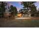 Backyard features a pergola with seating, a storage shed, mature trees, and landscaping at 2958 E Euclid Pl, Centennial, CO 80121