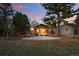 Backyard features a pergola with seating, a storage shed, mature trees, and landscaping at 2958 E Euclid Pl, Centennial, CO 80121