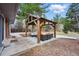 Landscaped backyard with patio and pergola, providing an ideal space for outdoor activities and gatherings at 2958 E Euclid Pl, Centennial, CO 80121
