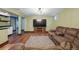 Cozy finished basement features a large TV, comfortable seating, and ample space for entertaining and relaxation at 2958 E Euclid Pl, Centennial, CO 80121