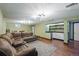 Finished basement with a large sectional sofa, built in bar, and modern lighting at 2958 E Euclid Pl, Centennial, CO 80121