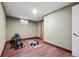 Basement exercise room with work-out equipment and weights on hardwood floors with neutral-toned paint at 2958 E Euclid Pl, Centennial, CO 80121