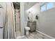 Finished bathroom with a walk-in shower, decorative mirror, and wood-style flooring at 2958 E Euclid Pl, Centennial, CO 80121