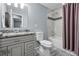Updated bathroom featuring modern vanity, decorative tile and tub shower combo at 2958 E Euclid Pl, Centennial, CO 80121