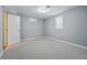 Bedroom with neutral-toned paint and carpet, as well as a window and a closet for storage at 2958 E Euclid Pl, Centennial, CO 80121
