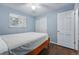 Serene bedroom with a comfy bed, white walls, and bright natural light from a window at 2958 E Euclid Pl, Centennial, CO 80121