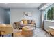 Living room featuring hardwood floors, neutral color scheme and a large window at 2958 E Euclid Pl, Centennial, CO 80121