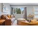 Living room featuring hardwood floors, neutral color scheme and a large window at 2958 E Euclid Pl, Centennial, CO 80121