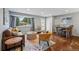 Spacious living room featuring hardwood floors, neutral color scheme, large windows and dining area at 2958 E Euclid Pl, Centennial, CO 80121