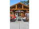 Charming patio featuring comfortable seating under a rustic wood pergola, enhancing outdoor living at 2958 E Euclid Pl, Centennial, CO 80121
