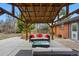 Pergola with outdoor seating and lighting, a paved patio, and a view of the fenced-in yard at 2958 E Euclid Pl, Centennial, CO 80121