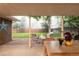 Backyard is fully equipped for entertainment, including a patio, dining table, and fire pit at 9861 E Ohio Ave, Denver, CO 80247