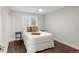 Neutral bedroom with hardwood floors, plantation shutters, and modern decor at 9861 E Ohio Ave, Denver, CO 80247