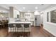 Bright kitchen featuring stainless steel appliances, modern cabinetry, and a breakfast bar at 9861 E Ohio Ave, Denver, CO 80247