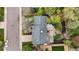 Aerial view of a home and tree-lined street showing roof, driveway, and partial backyard at 7282 S Vance St, Littleton, CO 80128
