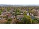 Panoramic aerial view of homes nestled among mature trees, offering a sense of community at 7282 S Vance St, Littleton, CO 80128
