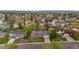 Expansive aerial view of a neighborhood showcasing various homes and lush green trees at 7282 S Vance St, Littleton, CO 80128