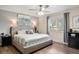 This main bedroom features a ceiling fan, a window, and stylish furnishings at 7282 S Vance St, Littleton, CO 80128