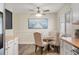 Bright dining area features a ceiling fan and a table set for four near a window at 7282 S Vance St, Littleton, CO 80128