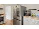 Modern kitchen featuring stainless steel refrigerator and appliances at 7282 S Vance St, Littleton, CO 80128