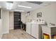 Functional laundry room with modern washer and dryer, and ample storage space and workspace at 7282 S Vance St, Littleton, CO 80128