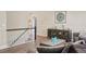 Bright living room showcasing a decorative cabinet, wood floors and wainscotting at 7282 S Vance St, Littleton, CO 80128