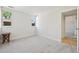 Bright bedroom with neutral carpet, baseboards, and trim plus two windows offering natural light at 3365 Chisholm Trl # B102, Boulder, CO 80301