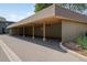 Spacious carport providing covered parking with a neatly landscaped area at 3365 Chisholm Trl # B102, Boulder, CO 80301