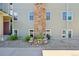 Exterior view showing stone accents, gravel landscaping, and a well-maintained lawn at 3365 Chisholm Trl # B102, Boulder, CO 80301