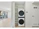 Convenient in-unit stacked washer and dryer with built-in shelving provide modern laundry solutions at 3365 Chisholm Trl # B102, Boulder, CO 80301
