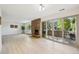 Spacious living area with a stone fireplace, large glass doors, and patio access at 3365 Chisholm Trl # B102, Boulder, CO 80301