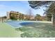 Outdoor tennis and basketball courts available for recreation in a landscaped community setting at 3365 Chisholm Trl # B102, Boulder, CO 80301
