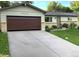 Charming single-story home with a well-manicured lawn, beautiful plants and a large driveway at 4665 E Peakview Ave, Centennial, CO 80121