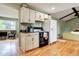 This kitchen features hardwood floors and leads to a living area with great natural light at 4665 E Peakview Ave, Centennial, CO 80121