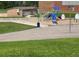 Community playground with swings, slides, and a basketball court, perfect for Gathering fun and recreation at 4665 E Peakview Ave, Centennial, CO 80121