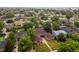 Aerial view of a well-manicured property with a lush green lawn and mature trees at 3555 Leyden St, Denver, CO 80207