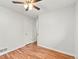Clean and bright bedroom featuring hardwood floors and neutral walls and doors at 3555 Leyden St, Denver, CO 80207