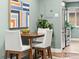 Charming dining area featuring modern art, comfortable seating, and easy kitchen access at 3555 Leyden St, Denver, CO 80207
