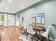 Cozy dining area with modern furnishings, hardwood floors, and bright natural light at 3555 Leyden St, Denver, CO 80207