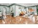 Spacious living room with modern decor, wood floors, and plenty of natural light at 3555 Leyden St, Denver, CO 80207