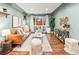 Bright living room with wood floors, stylish decor, and ample seating at 3555 Leyden St, Denver, CO 80207