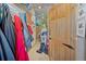 Functional hallway with coat racks, a wooden door, and ample storage space at 6100 Bear Paw Rd, Golden, CO 80403